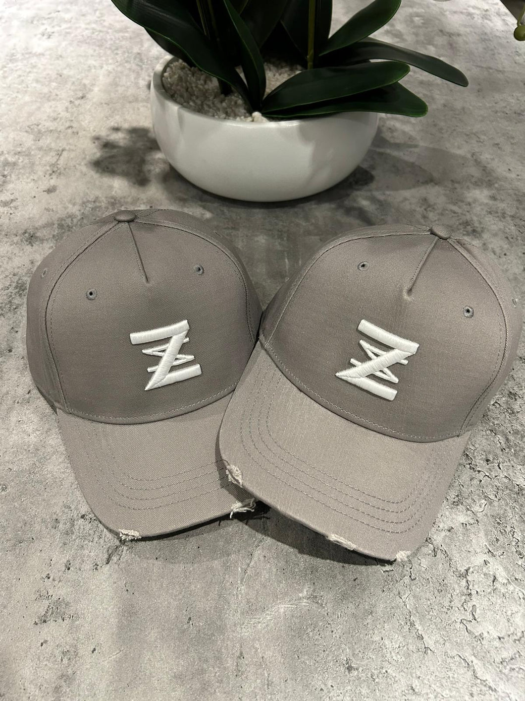 Grey distressed logo cap.