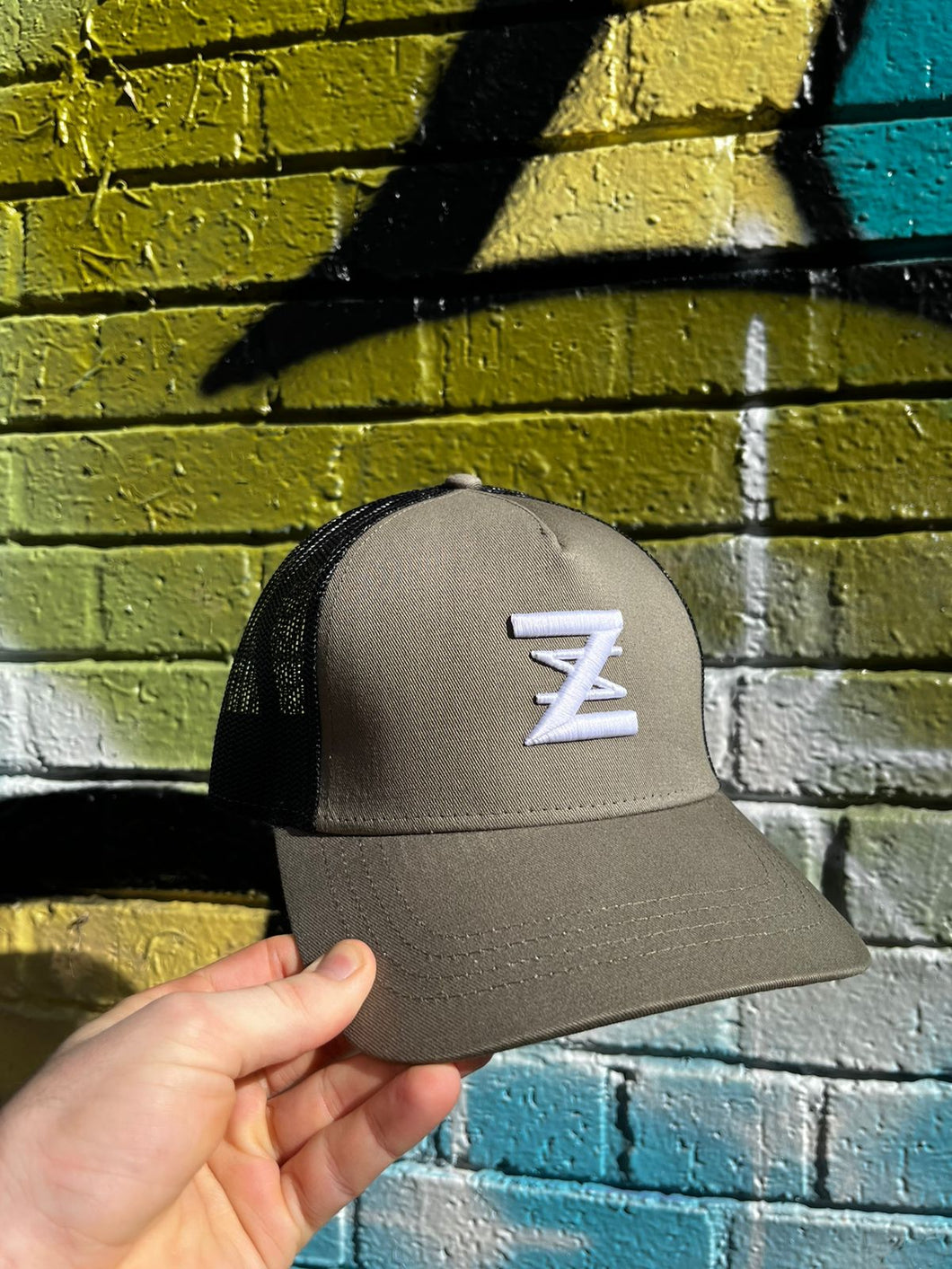 Khaki & Black logo cap.